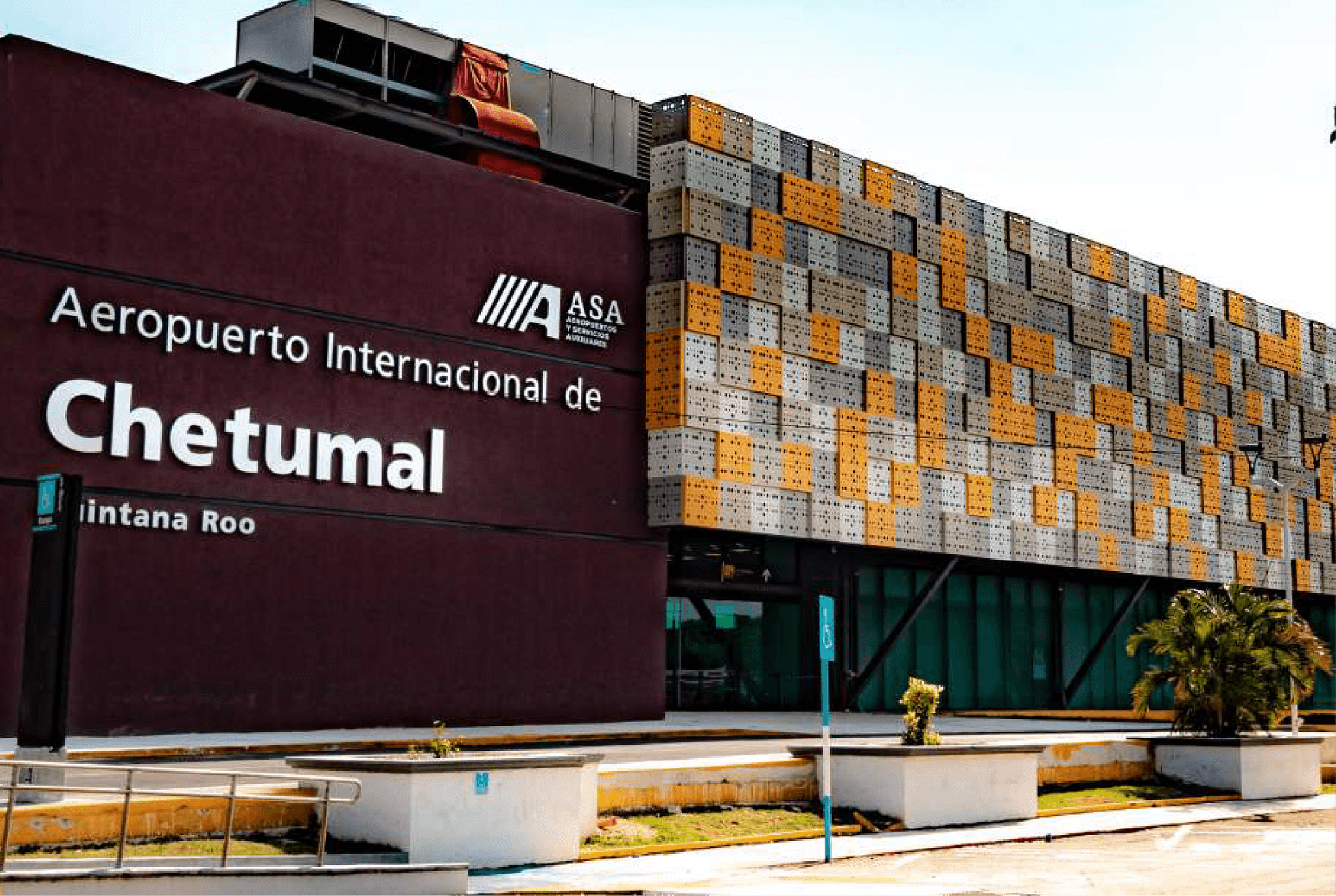 Facade of Chetumal International Airport, with its coloured lattice screen