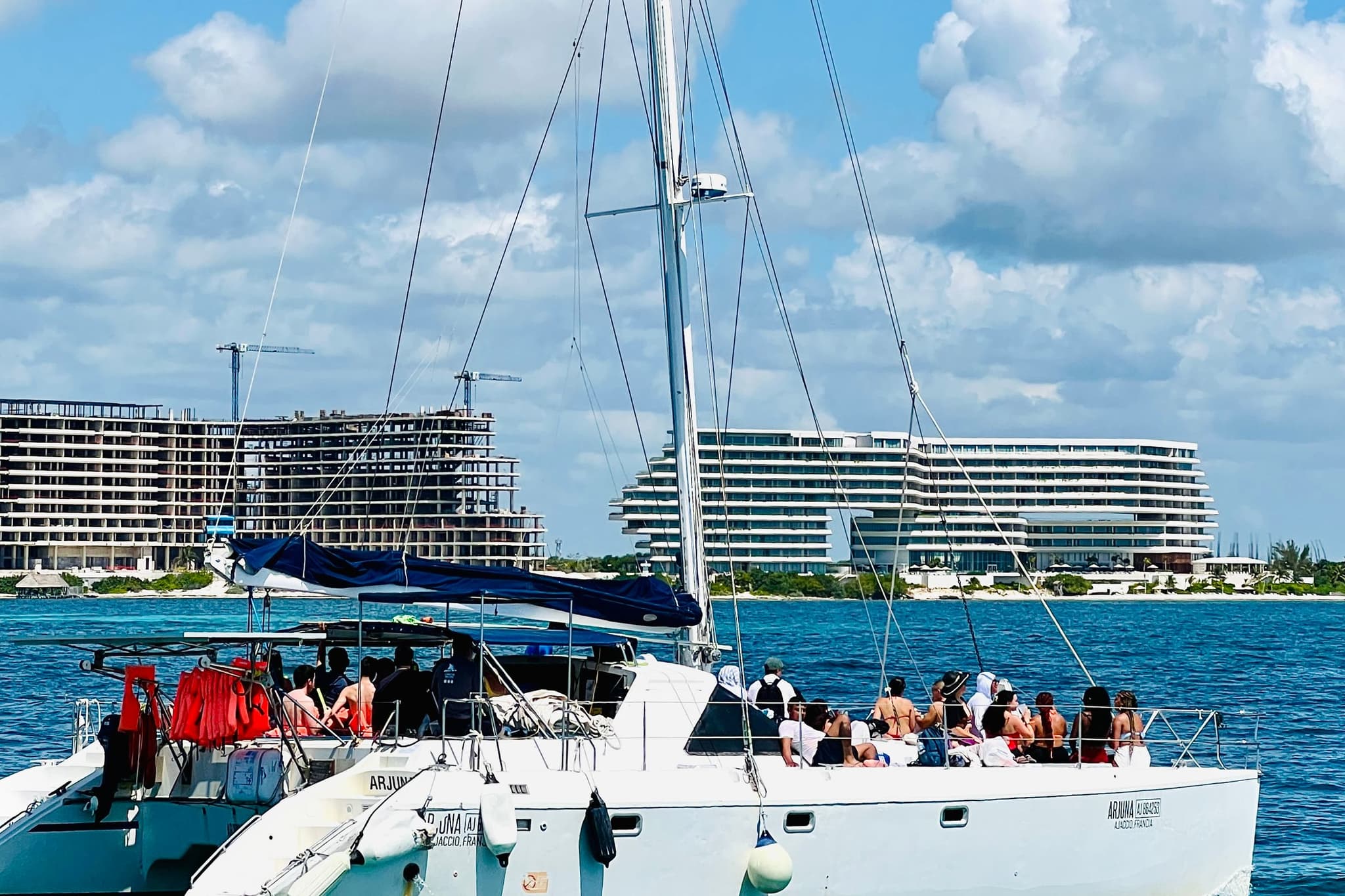 Passenger boat crossing the Caribbean Sea in front of the Cancun hotel zone