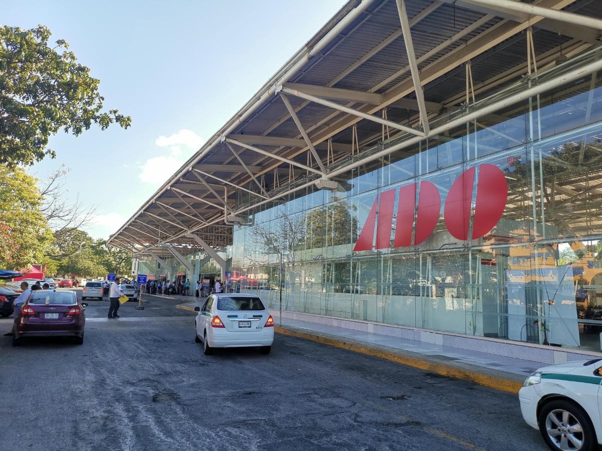 The ADO bus terminal in downtown Cancun, with its canopy and the platforms beyond