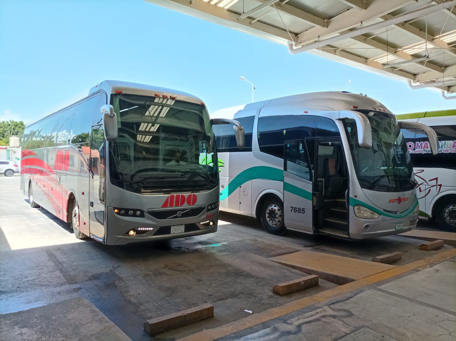 ADO and regional coaches at the platforms of the Bacalar bus terminal