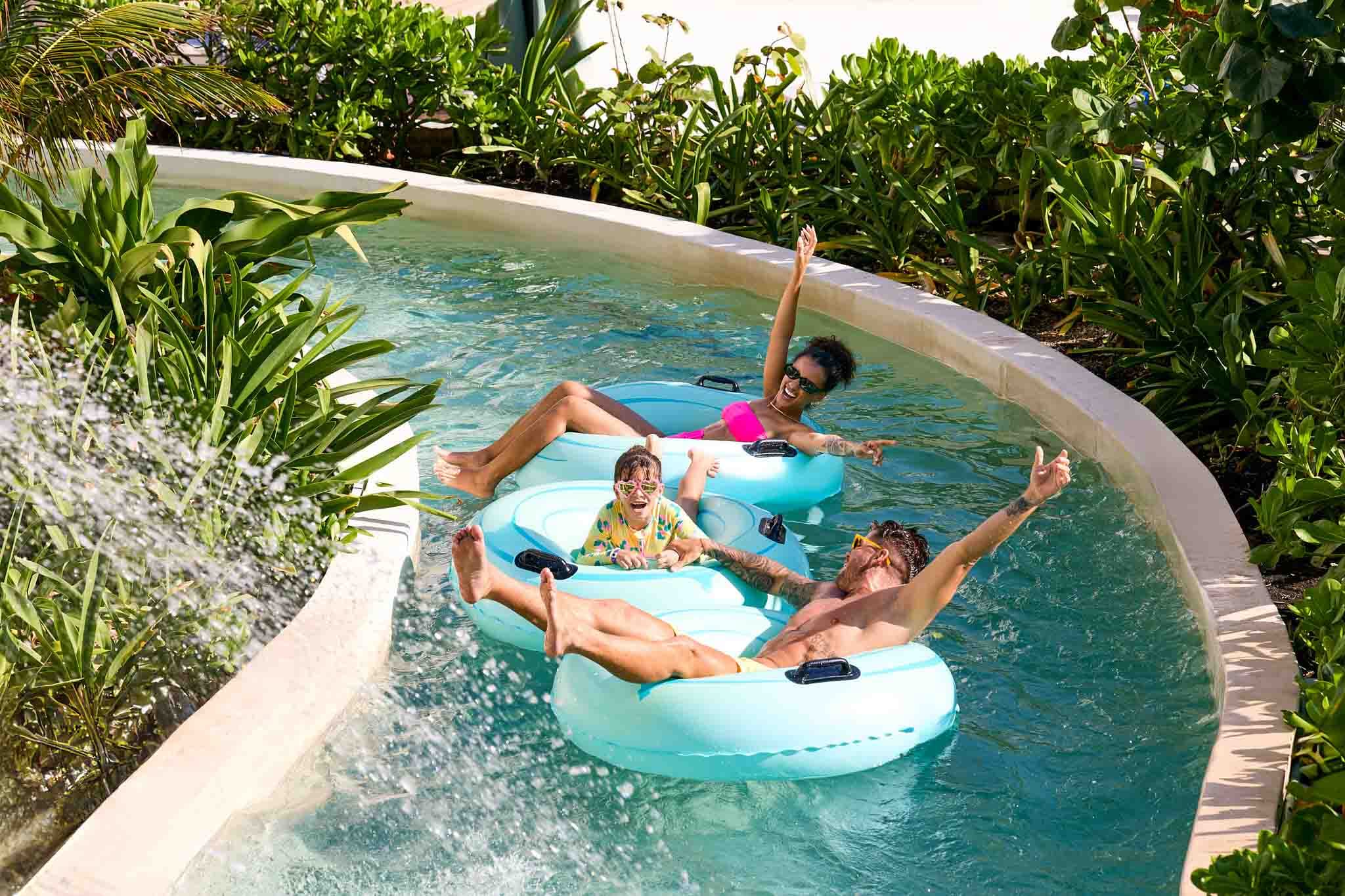 Family on a water park's lazy river