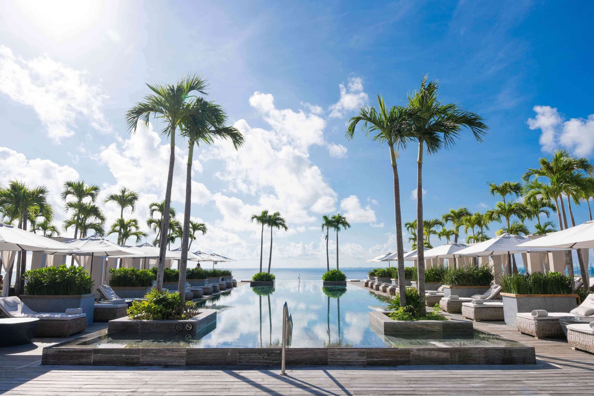 Pool and palms at a hotel facing the Caribbean Sea