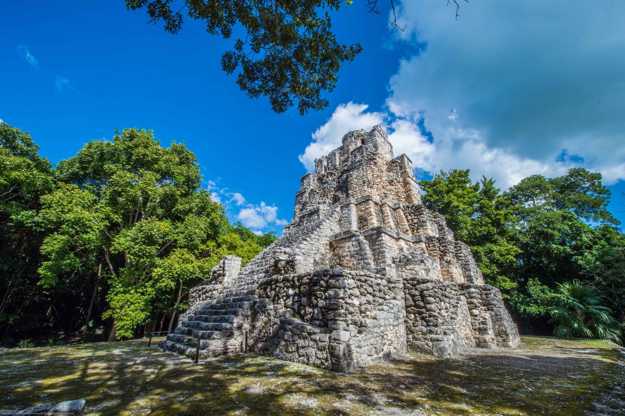 A stepped Maya temple surrounded by jungle in Maya Ka'an