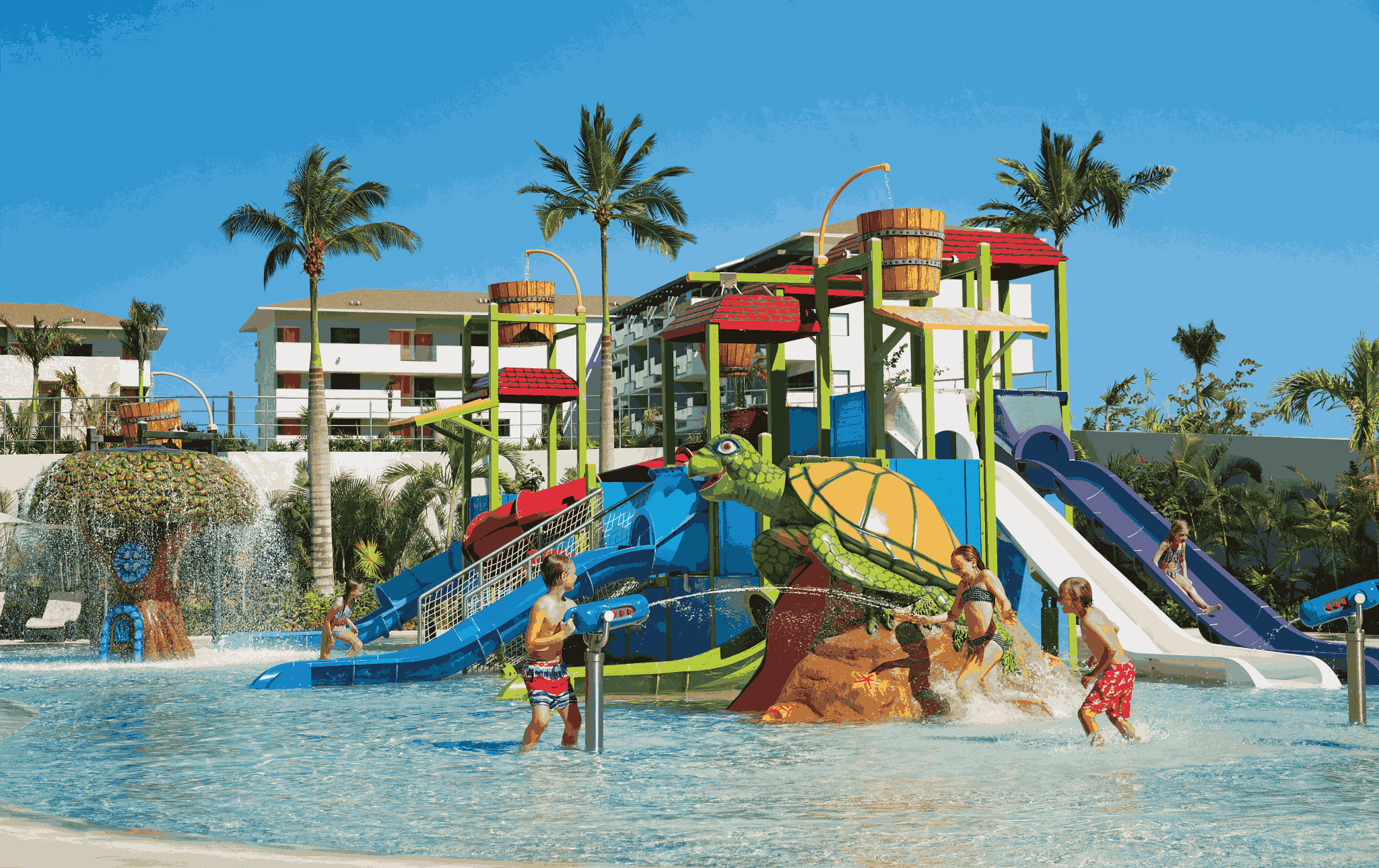 Kids going down the water slides at a Riviera Maya water park