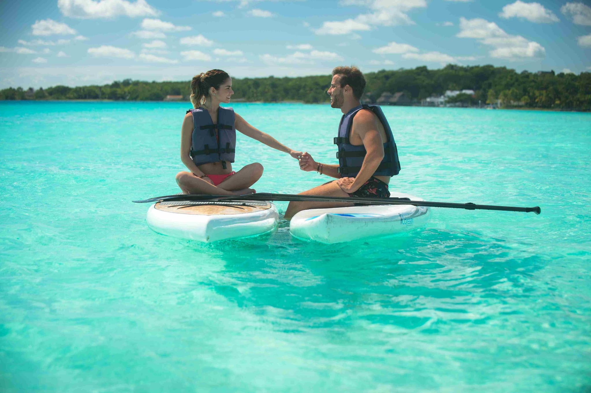 Couple paddleboarding on the Seven Colors Lagoon
