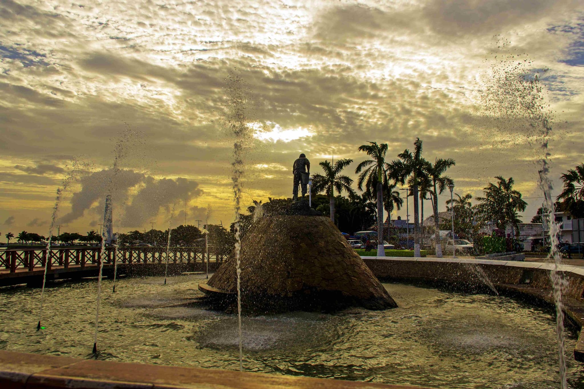 Fountains at the Chetumal waterfront monument at sunset