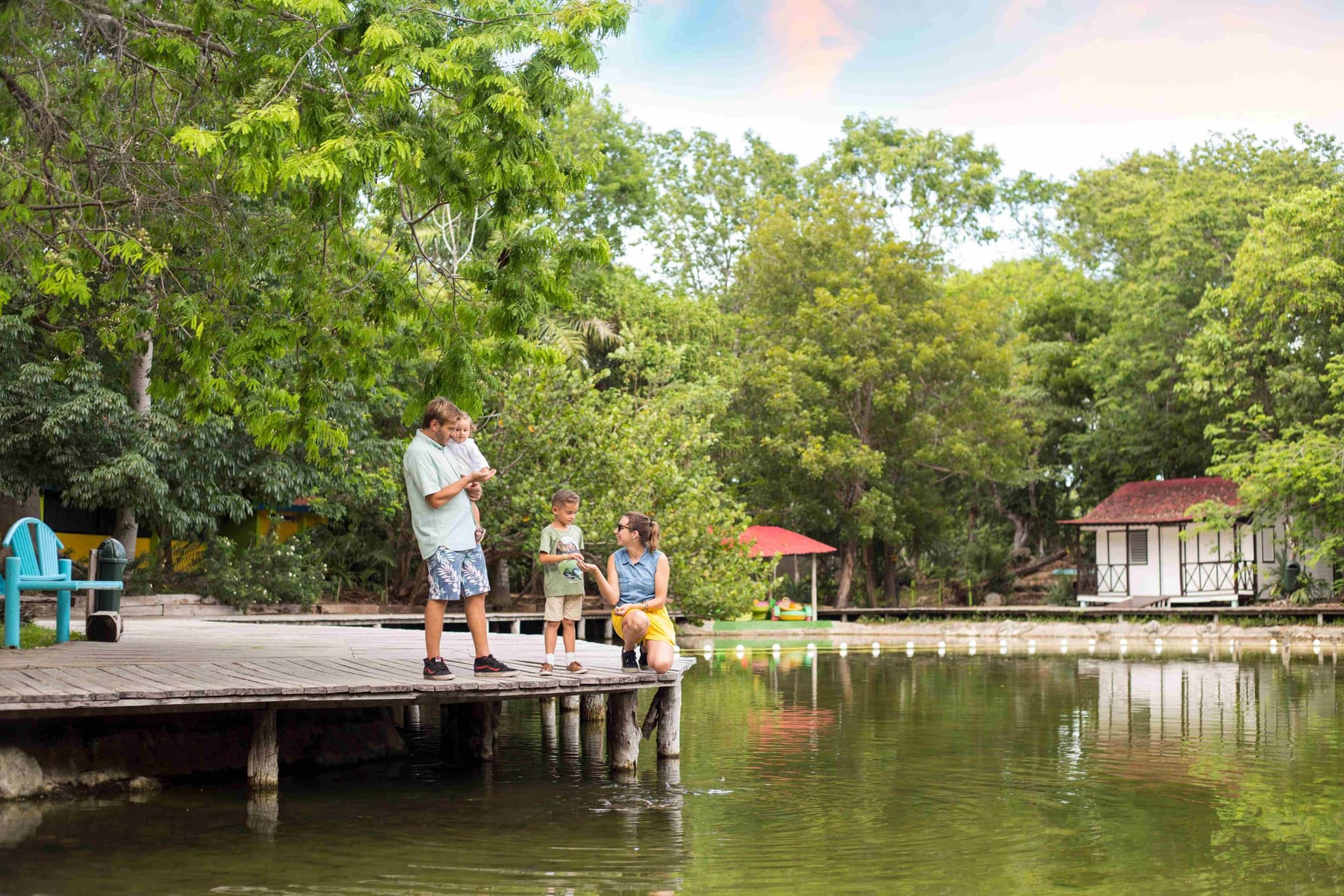 Family on a wooden dock at Laguna Milagros